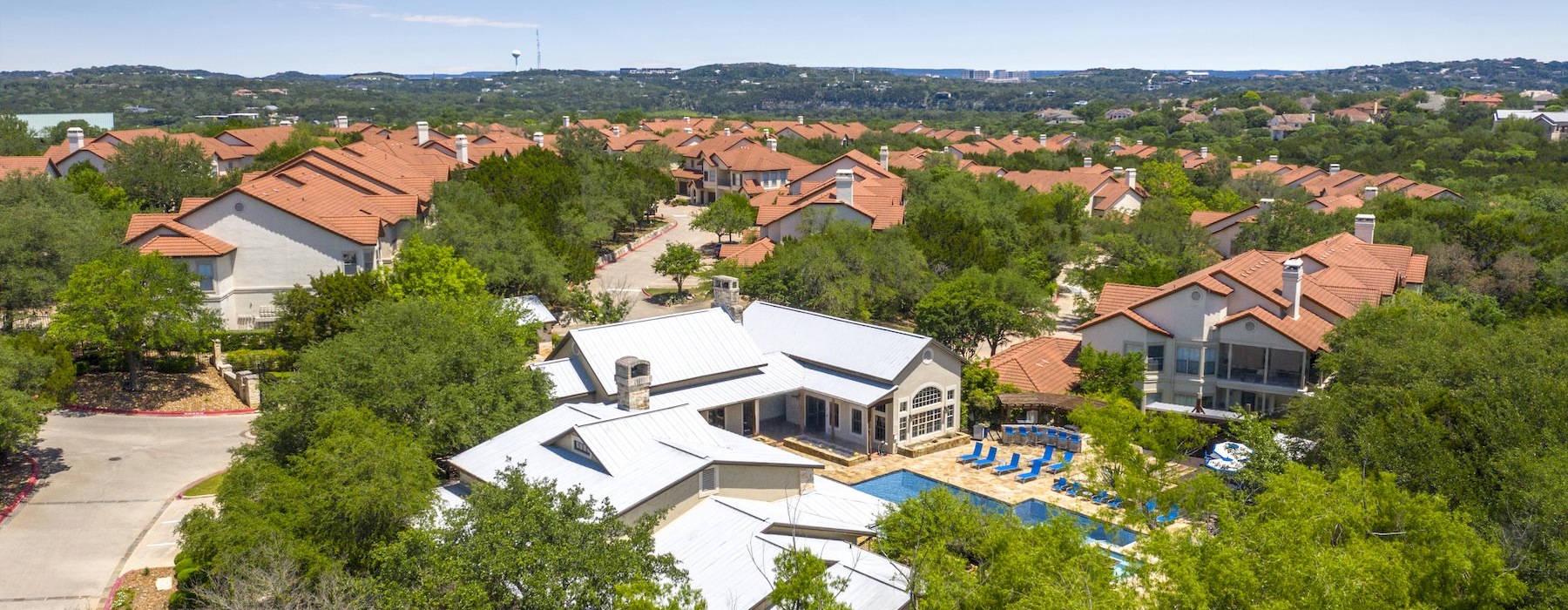 a group of houses surrounded by trees