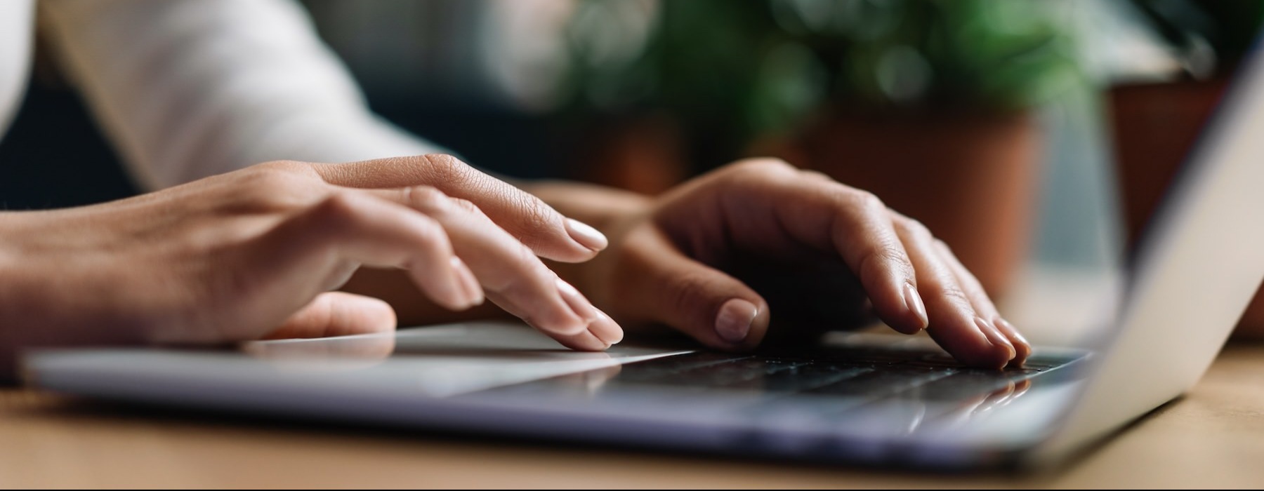 a person typing on a laptop