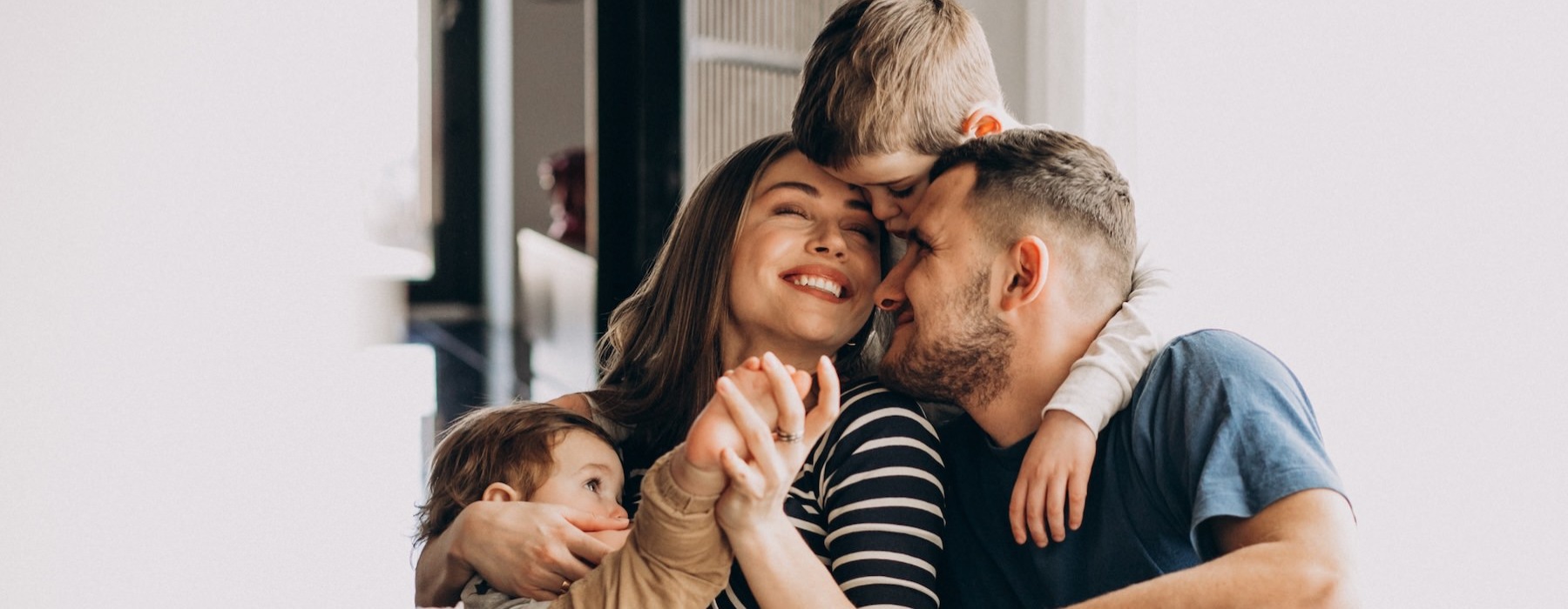 a family sitting on a couch