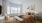 A bedroom with a bed, windows, and natural lighting