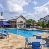 a pool with a building in the background