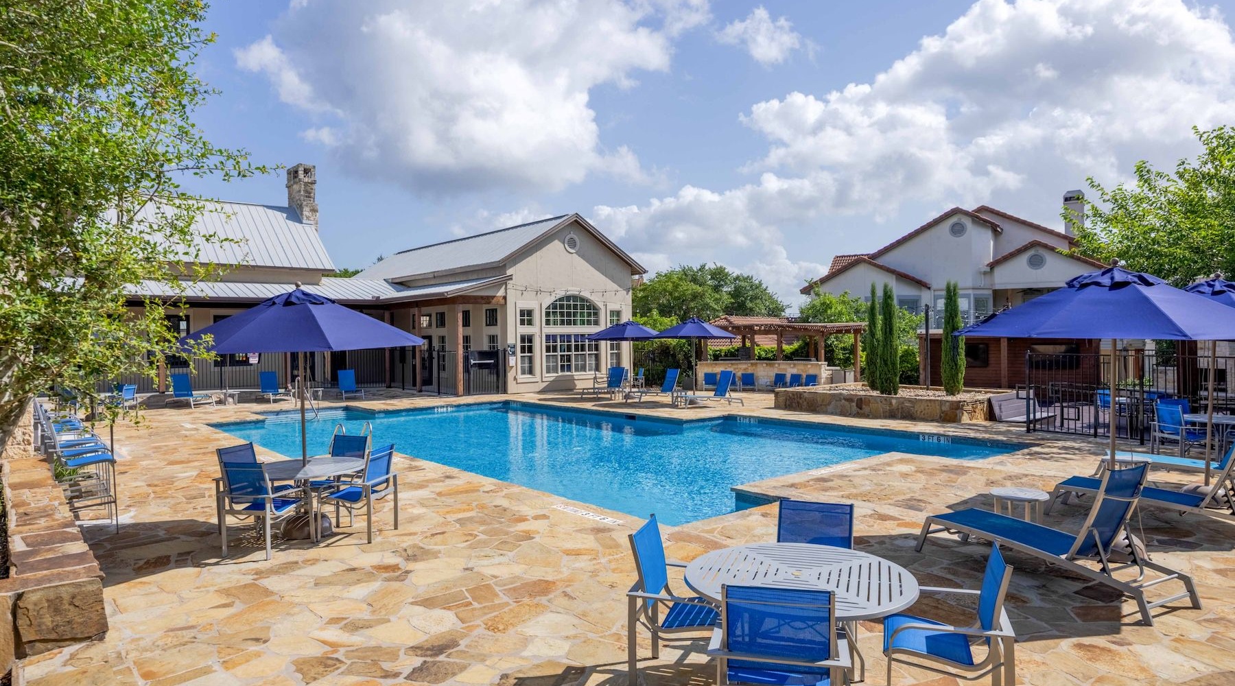 a pool with a building in the background