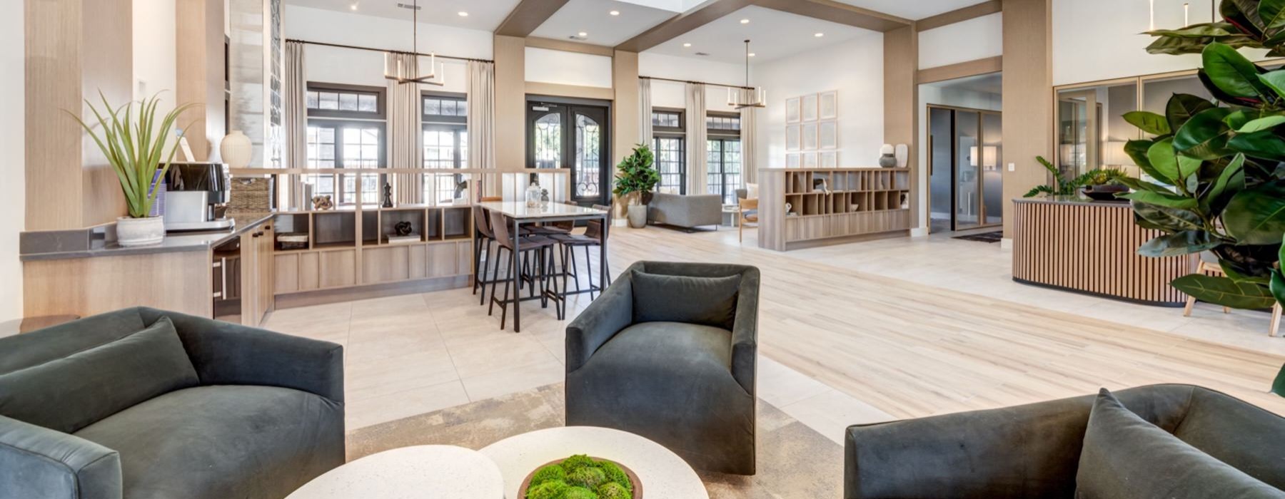 a large living room with a large kitchen and a dining area