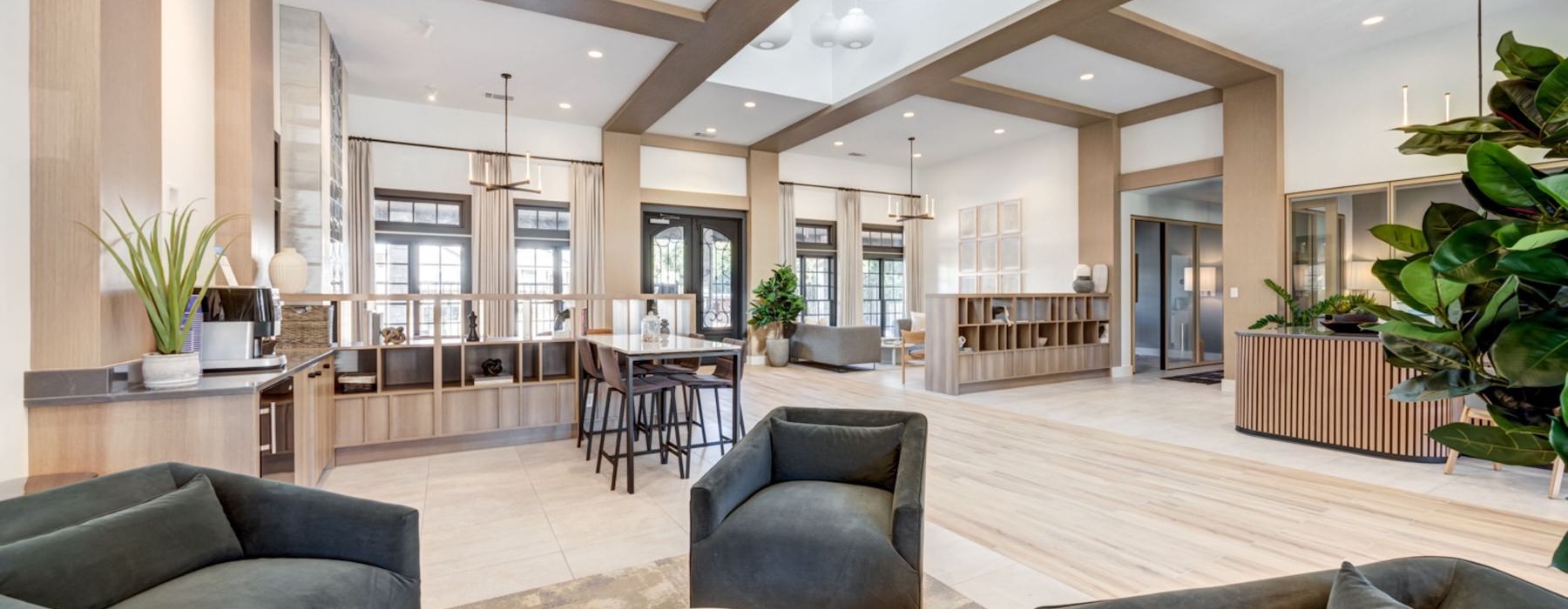 a large living room with a large kitchen and a dining area