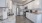 a kitchen with white cabinets