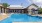 a swimming pool with umbrellas